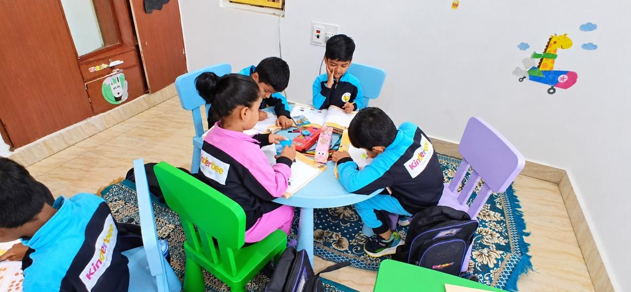 Kinderbee children learning in a small group